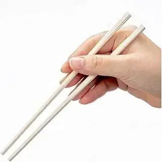 an image of a hand holding an already snapped chopsticks