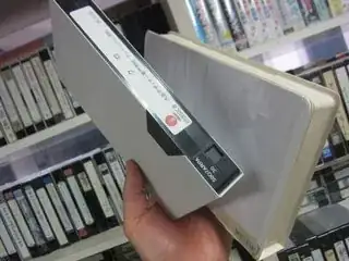 a VHS in a white box