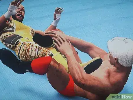 Image titled Do the Figure Four Leg Lock Step 4