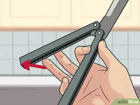 Image titled Perform a Trebuchet with a Butterfly Knife Step 4