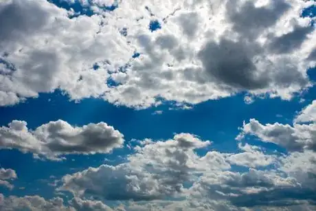 Image titled Dramatic dark clouds over bright sunny sky