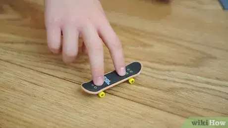 Image titled Ollie on a Tech Deck Using Three Fingers Step 6