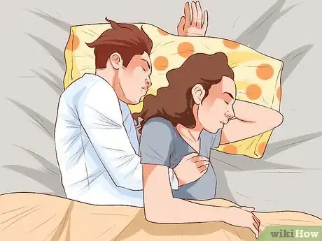 Image titled Avoid Trapping Your Arm While Snuggling in Bed Step 3