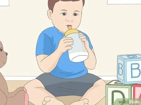 Image titled Get Your Child to Hold Their Own Bottle Step 3