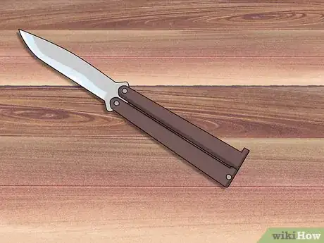 Image titled Perform a Trebuchet with a Butterfly Knife Step 1