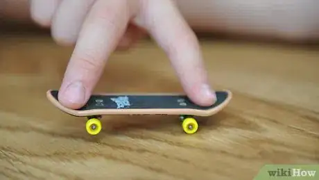 Image titled Ollie on a Tech Deck Using Three Fingers Step 5