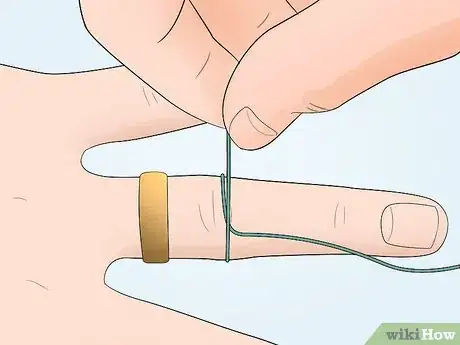 Image titled Remove a Ring with a String Step 2