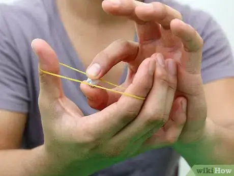 Image titled Make and Shoot Mini Paper Bullets with Rubber Bands Step 4