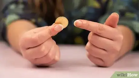 Image titled Do a Simple Coin Magic Trick Step 1