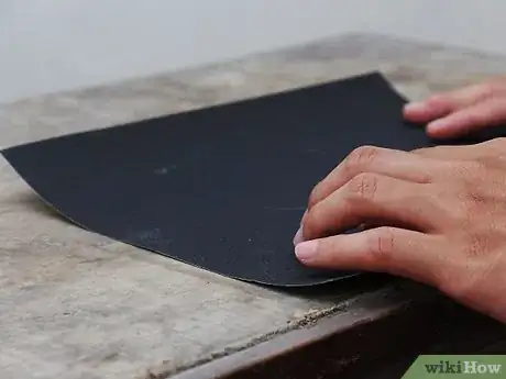 Image titled Sharpen Kitchen Knives with Sandpaper Step 2