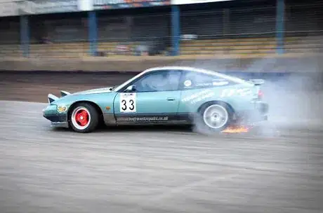 Image titled Phil Cracknell's 200SX caught seconds before a tire exploded; right before they explode, spectacular sparks like these are thrown out as the carcass is worn through.