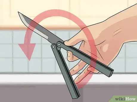 Image titled Perform a Trebuchet with a Butterfly Knife Step 7