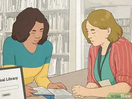 Image titled Woman looking through a book in a community library with the librarian.