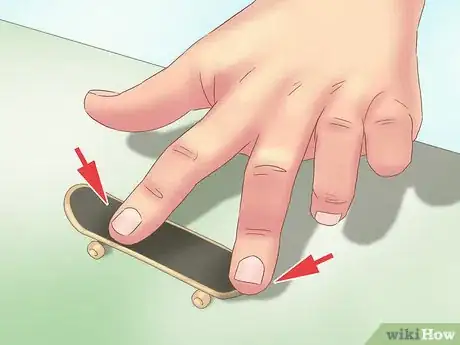 Image titled Kickflip on a Tech Deck Step 1